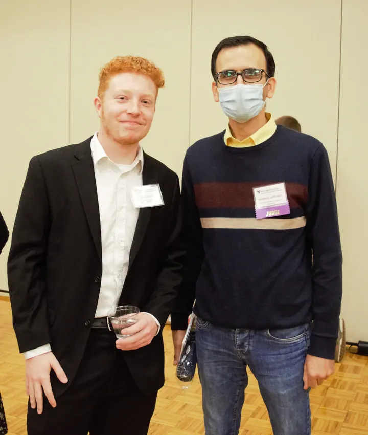Habib Latifizadeh beside a student presenter at the WVU Undergraduate Research Symposium